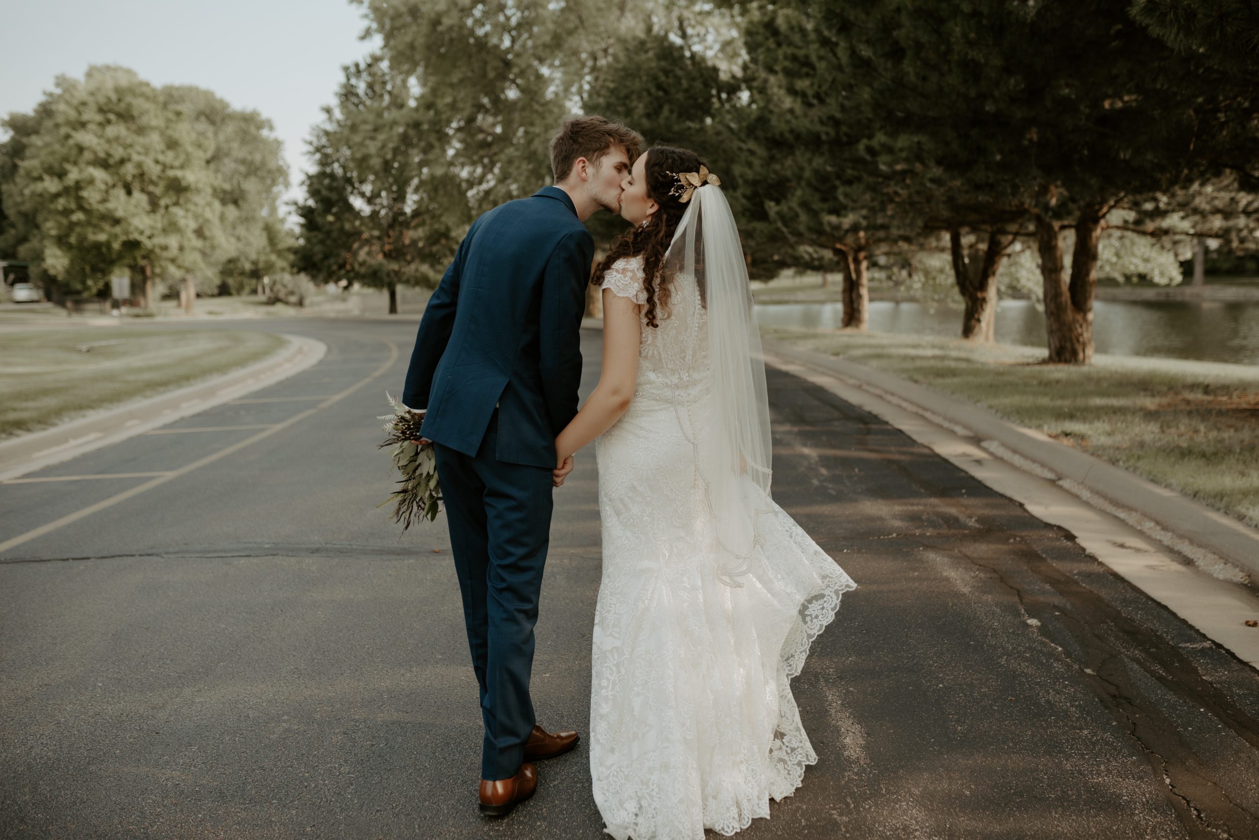 couple kissing on wedding day