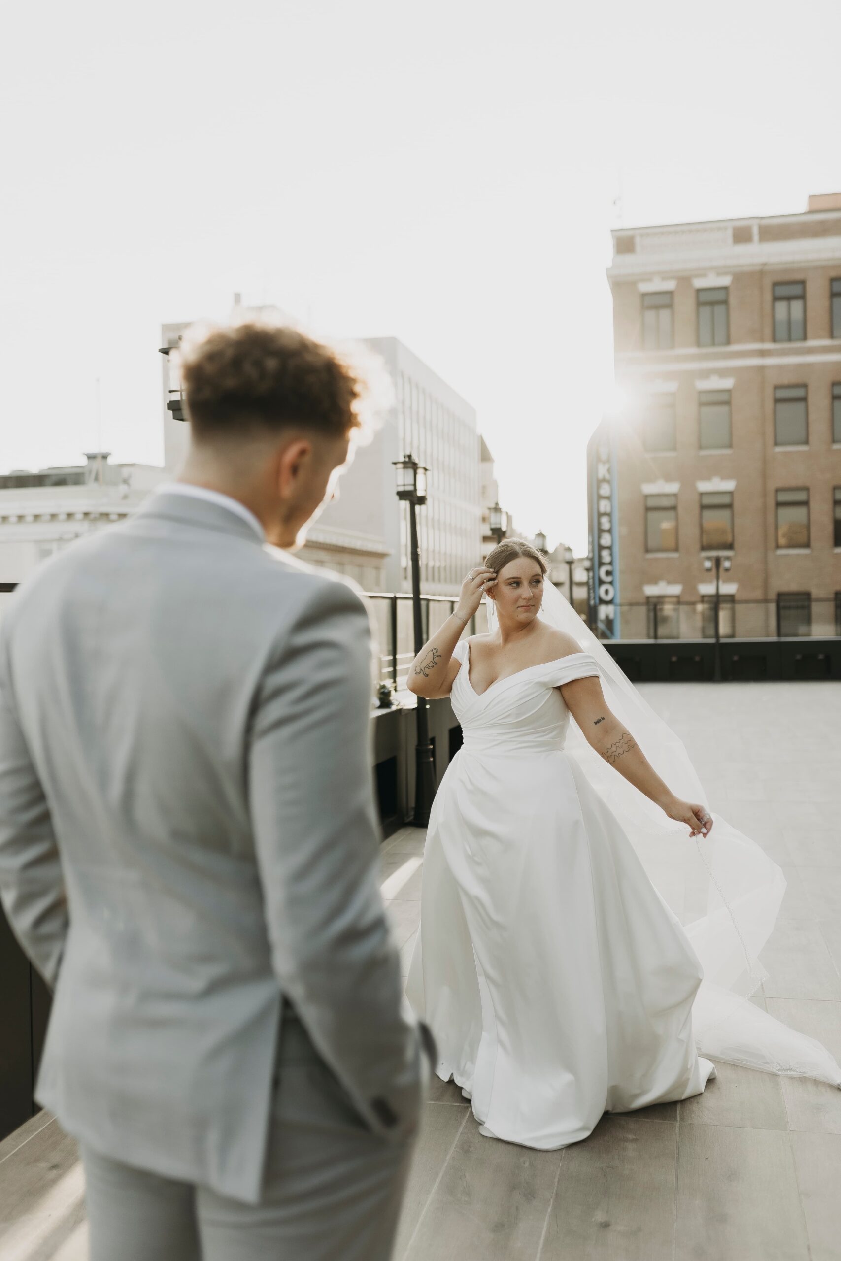 couple nose to nose under bridal veil