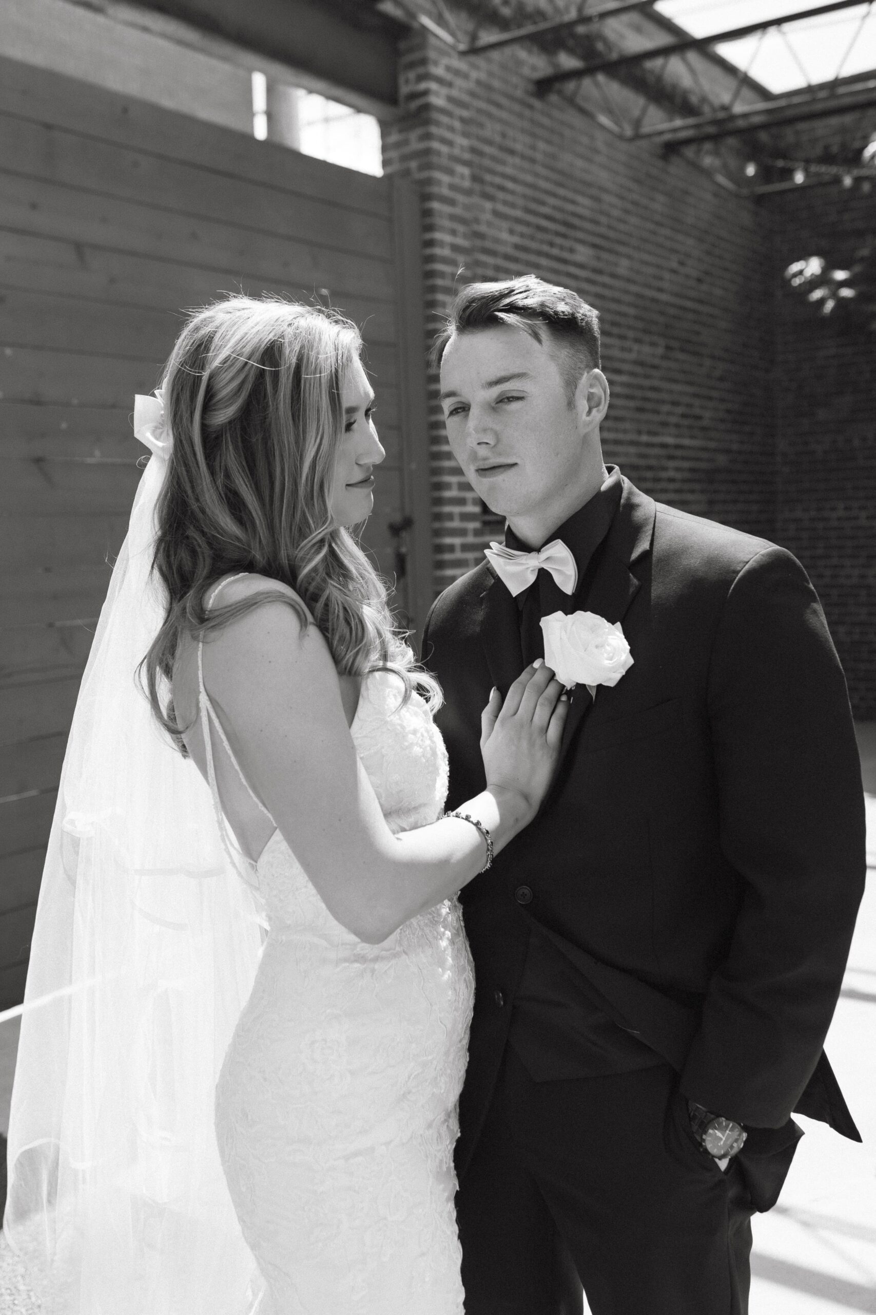 bride and groom posing for Wichita wedding photographer